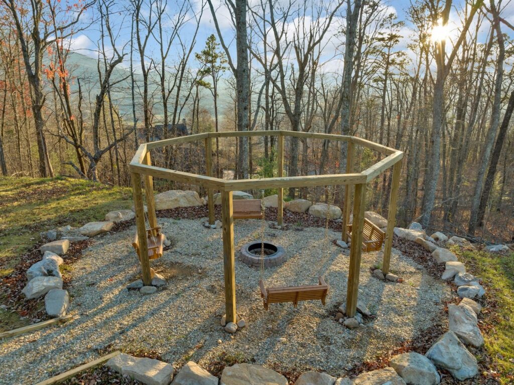 Outdoor fire pit with swings