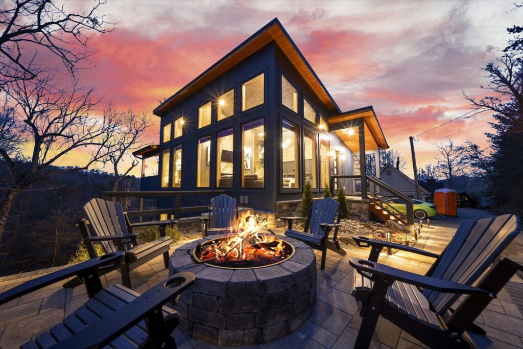 Modern Bearadise Ridge cabin nestled in the trees with a spacious deck and mountain views