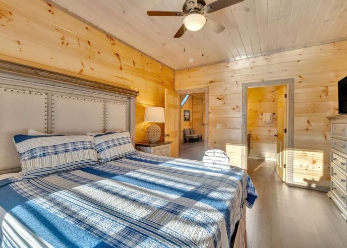 Spacious King bedroom with TV in 6 bedroom cabin